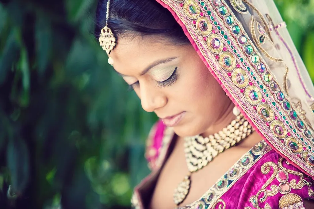 Close-up bridal makeup and jewelry portrait for destination wedding